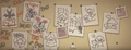 The wall of drawings as seen in ending 20.